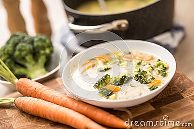 Vegetable soup from broccoli carrot onion and other ingredients. Healthy vegetarian food and meals Stock Photo