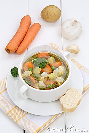 Vegetable soup meal with vegetables and baguette Stock Photo