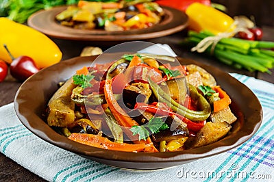 Vegetable stew salad: bell pepper, eggplant, asparagus beans, garlic, carrot, leek. Bright spicy aromatic dishes Stock Photo