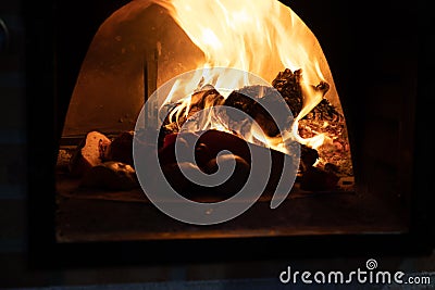 Vegetables cooking in a woodfired oven Stock Photo