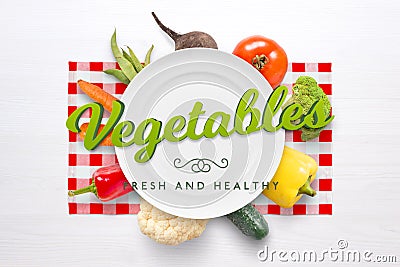 Vegetables fresh and healthy text. Plate and vegetables in background Stock Photo