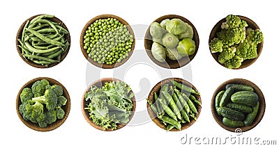 Vegetables isolated on a white. Squash, green peas, broccoli, kale leaves and green bean in wooden bowl. Vegetables with copy spac Stock Photo