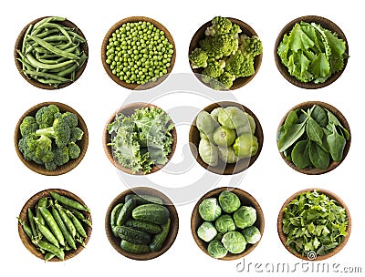 Vegetables isolated on a white. Squash, green peas, broccoli, kale leaves and green bean in wooden bowl. Vegetables with copy spac Stock Photo