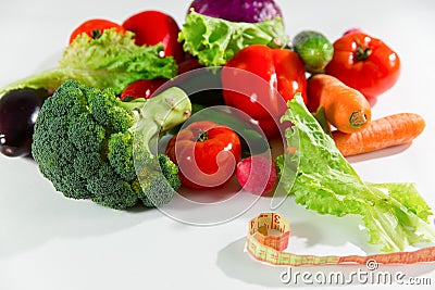 Vegetables and measuring tape, still life isolated on white background Stock Photo