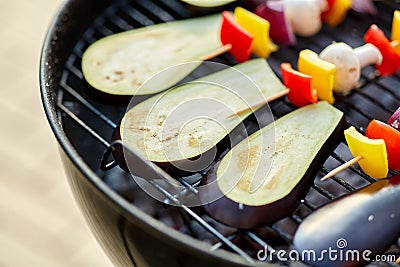 Vegetables and mushrooms roasting on brazier grill Stock Photo