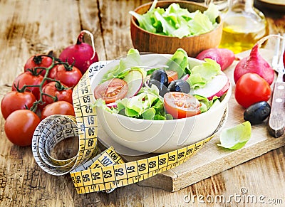 Vegetables Salad with Measure Tape.Healthy Diet Concept Stock Photo