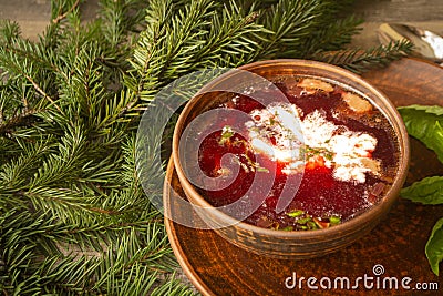 Vegetarian borscht soup of beetroot, carrot, cabbage, potato, onion and celery in rustic bowl, winter hot dish, country Stock Photo