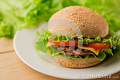 Vegetarian burger with fresh salad on the plate, close up Stock Photo