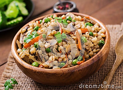 Vegetarian crumbly pearl barley porridge Stock Photo