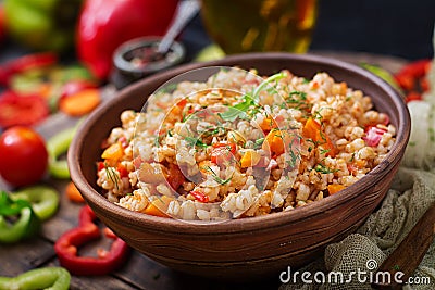 Vegetarian crumbly pearl barley porridge with vegetables Stock Photo