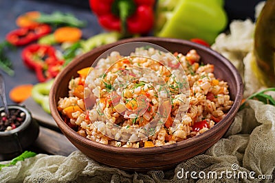 Vegetarian crumbly pearl barley porridge with vegetables Stock Photo