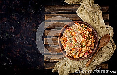 Vegetarian crumbly pearl barley porridge with vegetables Stock Photo