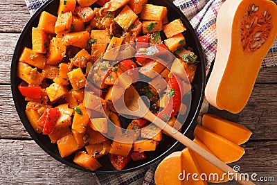 Vegetarian food: pumpkin curry close-up. Horizontal top view Stock Photo