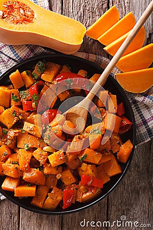 Vegetarian food: pumpkin curry close-up. Vertical top view Stock Photo