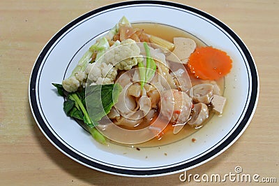 Vegetarian fried large noodle in gravy sauce Stock Photo