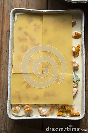 Preparing vegetarian lasagne with pumpkin, spinach, three cheese Stock Photo
