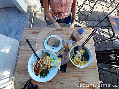 Vegetarian noodles in sanur denpasar with bread and fermented milk from soya Editorial Stock Photo