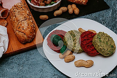 Vegetarian patty with chickpeas, patty beetroots, beans basil and peanuts on a plate. Healthy food for vegans, healthy food, menu Stock Photo