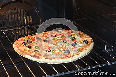 Vegetarian pizza in oven Stock Photo
