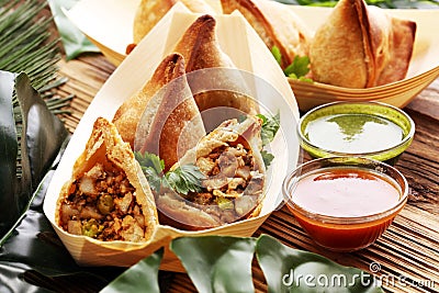 Vegetarian samsa or samosas.Indian special traditional street food punjabi samosa or Coxinha, Croquete and other Fried Brazilian Stock Photo