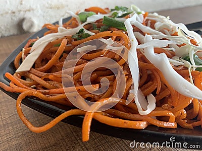 Vegetarian Schezwan Noodles or Vegetable Hakka Noodles or Chow Mein in bowl. Stock Photo