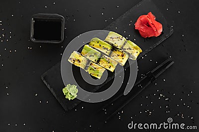 Vegetarian sushi rolls avocado with cream Philadelphia cheese, sesame, unagi sauce. Sushi menu. Japanese food. Stock Photo