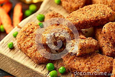 Vegetarian vegan southern style crispy nuggets served with sweet potato chips and beer Stock Photo