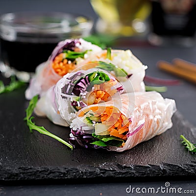 Vegetarian vietnamese spring rolls with spicy sauce, carrot, cucumber Stock Photo