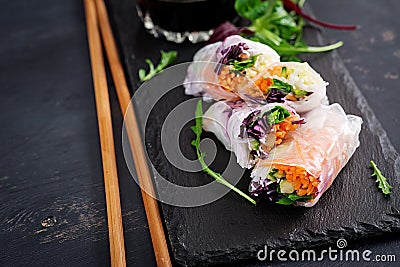 Vegetarian vietnamese spring rolls with spicy sauce, carrot, cucumber, Stock Photo