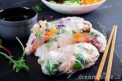 Vegetarian vietnamese spring rolls with spicy shrimps, prawns, carrot, cucumber Stock Photo