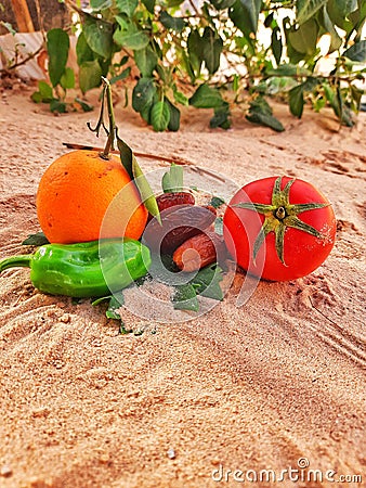 Vegetation foods and healthy fruits orange and dates palms Stock Photo