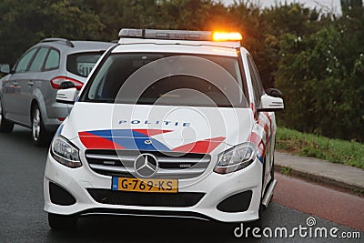 Vehicle of the dutch police named Politie at car crash in Nieuwerkerk Editorial Stock Photo