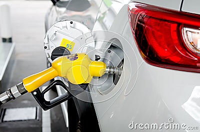 Vehicle is filling a petroleum at gas station Stock Photo