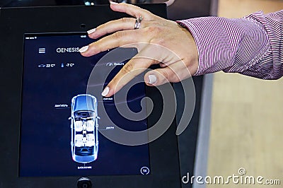 The vehicle through the tablet remote control system on Connected Car 2016 Editorial Stock Photo