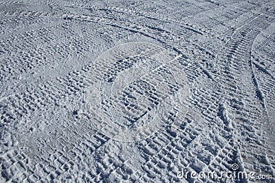 Vehicle tracks crossing the snowy terrain Stock Photo