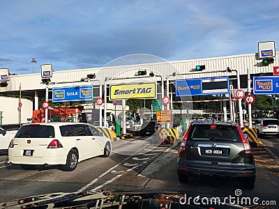 Vehicles entering highway toll canopy in Malaysia. Editorial Stock Photo
