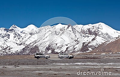 Vehicles goes on the mountain way in Ngari prefecture, Western Tibet Stock Photo