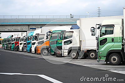 Vehicles parking at Kusatsu Parking area of Meishin Expressway at break of day Editorial Stock Photo