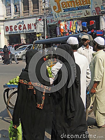 Veiled muslim women shop Editorial Stock Photo