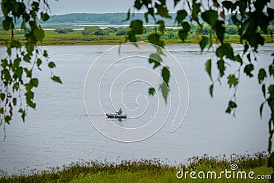 Lonely fisherman on the Volkhov river Stock Photo