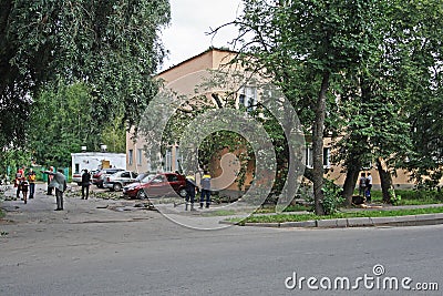 Rescue service arrived at the scene with a tree falling on the building due to a very high wind in Veliky Novgorod Editorial Stock Photo