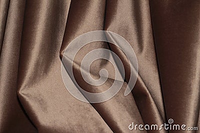Velour background with drapery. Velour color of coffee with milk. Velour background with pleats Stock Photo
