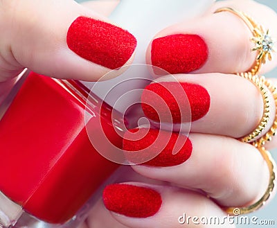 Velvet nails. Fashion trendy red fluffy nailart design Stock Photo