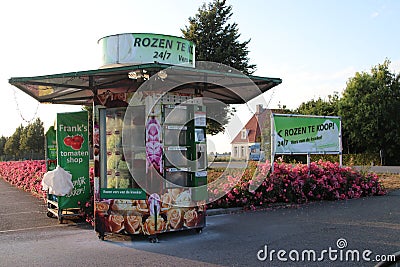 Vending machine with Roses at a greenhouse nursey where people can buy 24/7 roses in Moerkapelle in the Netherlands. Editorial Stock Photo