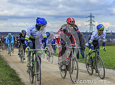 The Peloton on a Dirty Road - Paris-Nice 2016 Editorial Stock Photo