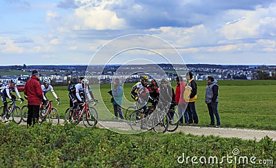 The Peloton on a Dirty Road - Paris-Nice 2016 Editorial Stock Photo