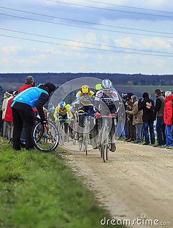 The Peloton on a Dirty Road - Paris-Nice 2016 Editorial Stock Photo