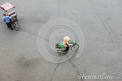 Vendor with bike of housewares on Hanoi street Stock Photo