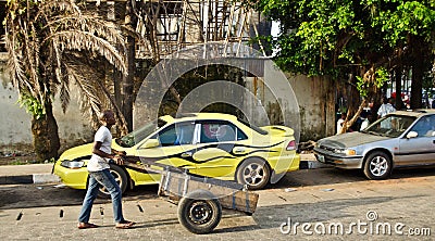 A vendor goes about his business around the port city of Lagos Editorial Stock Photo