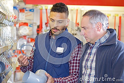 Vendor in hardware shop with client Stock Photo